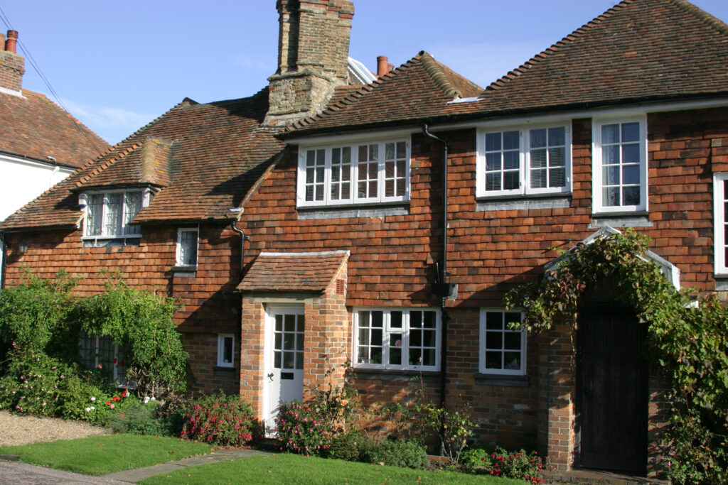 Period tile-hung houses in Sussex showing listed features including windows and doors